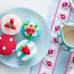 Summer tea party - 4 cupcakes on a plate with a jug of milk