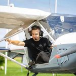 Young man in a small plane's cockpit
